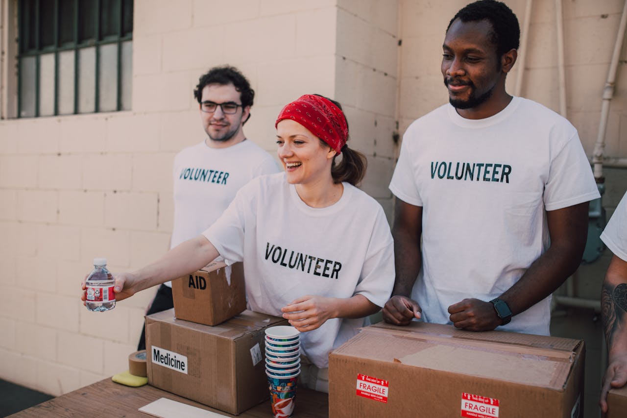 Volunteers collaborating on charitable activities for Camp Oyo